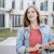 happy-young-female-caucasian-student-looking-away-at-university-campus-TCEF01373 Portrait of young blonde student at university in Granada, Spain woman women young student university